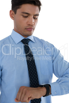 Businessman looking at smartwatch