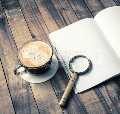Book, magnifier, coffee cup