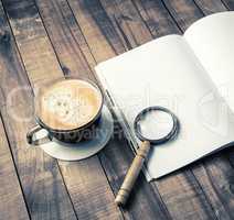 Book, magnifier, coffee cup