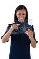 Female executive using a glass digital tablet