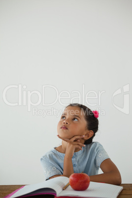 Thoughtful young girl sitting