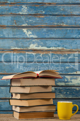 Stack of books and coffee cup