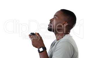 Man playing video game against white background