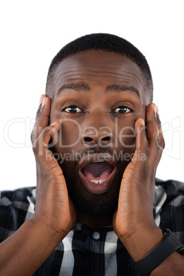 Surprised man against white background