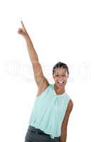 Excited businesswoman dancing against white background