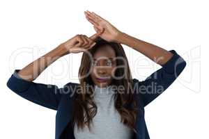 Portrait of businesswoman gesturing hand sign