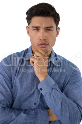 Portrait of businessman with hand on chin