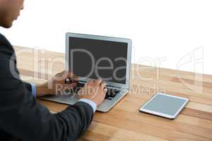 Side view of businessman using laptop computer