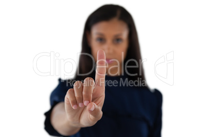 Female executive pressing an invisible virtual screen