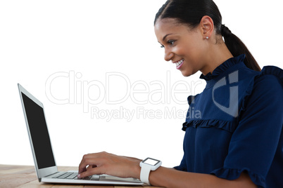 Businesswoman using laptop on the table