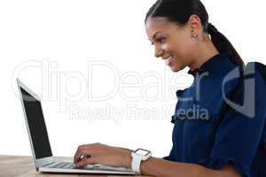 Businesswoman using laptop on the table