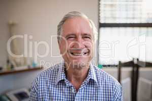 Close-up portrait of smiling senior male patient