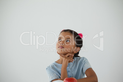 Thoughtful young girl sitting