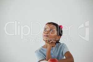 Thoughtful young girl sitting