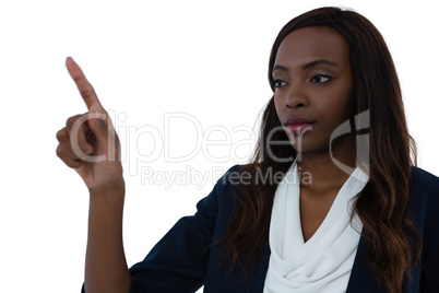 Confident businesswoman gesturing on imaginary screen