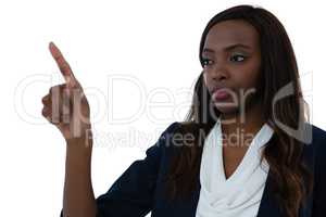 Confident businesswoman gesturing on imaginary screen