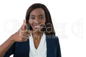 Close up portrait of smiling businesswoman showing thumbs up