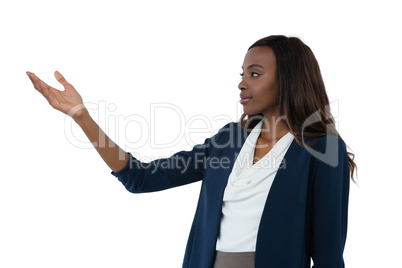 Businesswoman gesturing while giving presentation