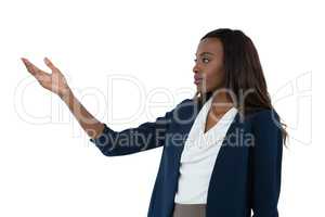 Businesswoman gesturing while giving presentation