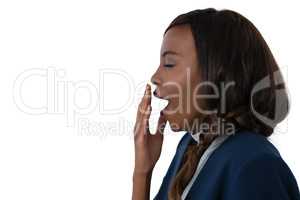 Side view of businesswoman yawning