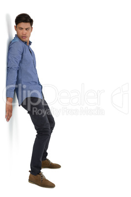 Full length of businessman pushing something