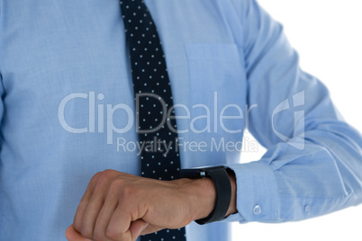Mid section of businessman with smartwatch