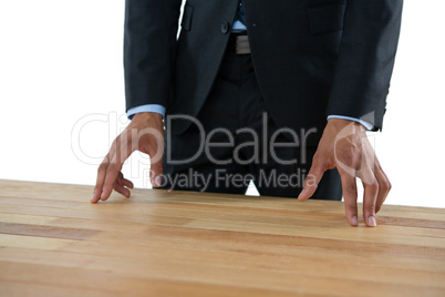 Close up of businessman gesturing while standing at table