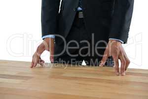 Close up of businessman gesturing while standing at table