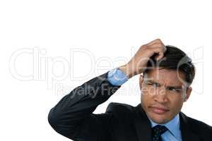 Close up of confused businessman with hand in hair