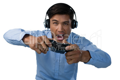 Businessman making face while playing video game