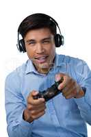 Portrait of smiling young businessman playing video game