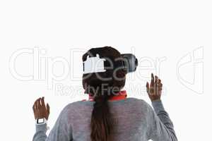 Rear view of female gesturing while using vr glasses
