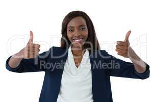 Portrait of happy businesswoman showing thumbs up