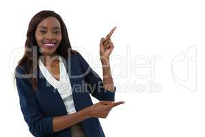 Portrait of smiling businesswoman gesturing