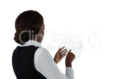 Side view of businesswoman with brown hair using glass interface