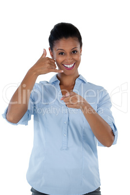 Businesswoman pretending to talk on a cell phone