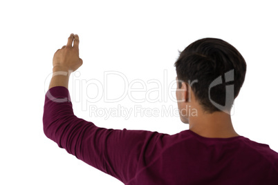 Rear view of businessman touching invisible imaginary screen