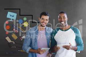 Happy business men holding a tablet against grey background with graphics