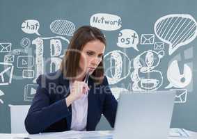 Thoughtful business woman at a desk  looking at a computer against blue background with graphics