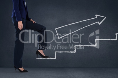 Business woman climbing stairs against blue background with white arrow