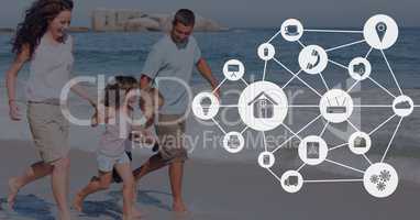Connected icons against family at the beach photo
