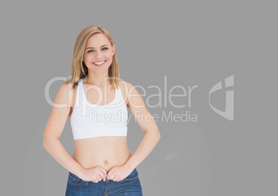 Portrait of fit woman with grey background