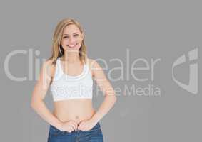 Portrait of fit woman with grey background