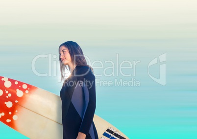 Surfer woman looking to left against blurry blue background