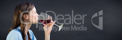 Woman tasting wine against navy chalkboard