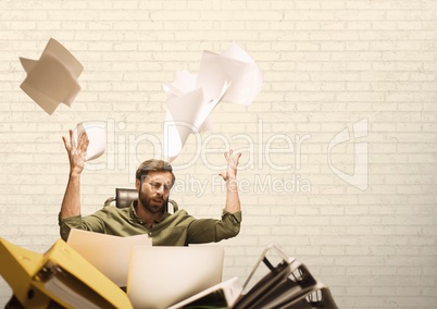 Frustrated business man throwing paper against white background