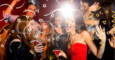 Happy group of young people  celebrating in night club