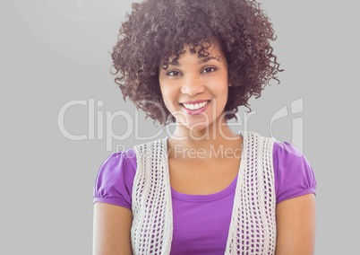 Portrait of woman with curly hair with grey background