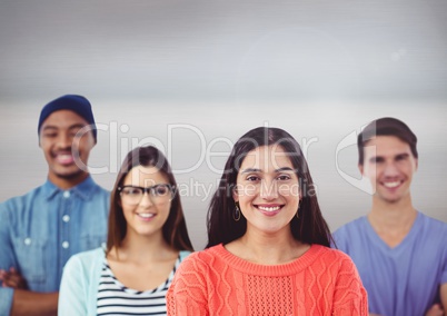 Group of multinational people standing in front of grey background