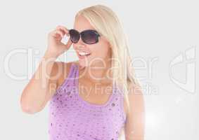 Portrait of woman in sunglasses with grey background